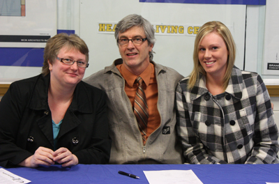 Meaghan Robertson, signing letter of intent to play at BU. Joined by her mother Pam and BU Athletic Director, Kirk De Fazio.