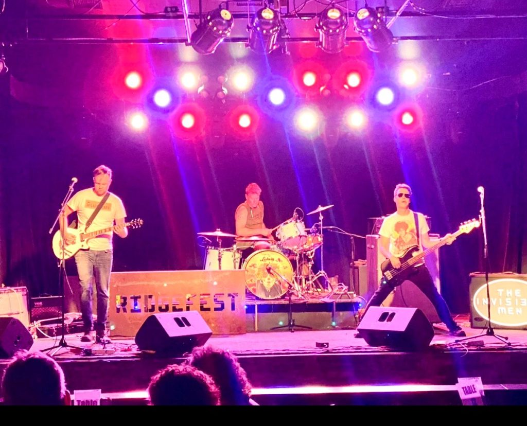 A band performs on stage.