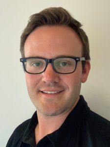 A young man in glasses.