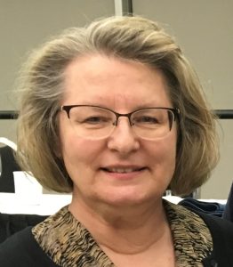 A woman in glasses.