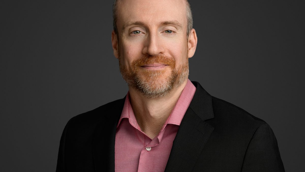 Portrait of a man with a beard.