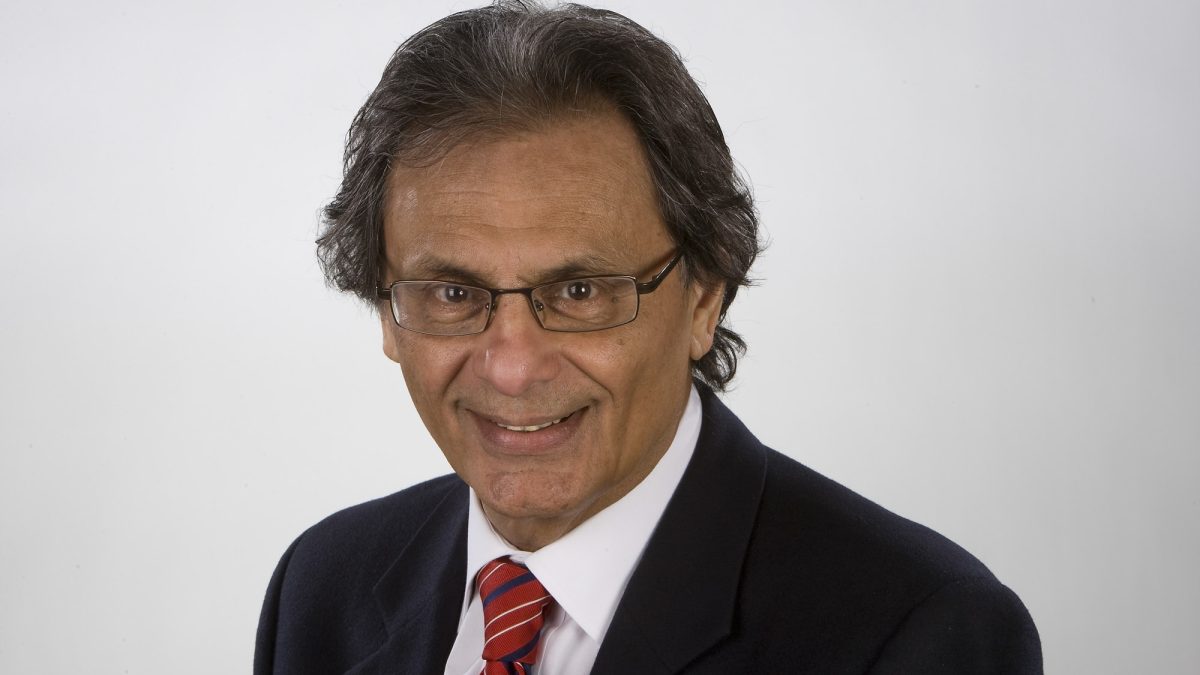 A man in glasses and a suit