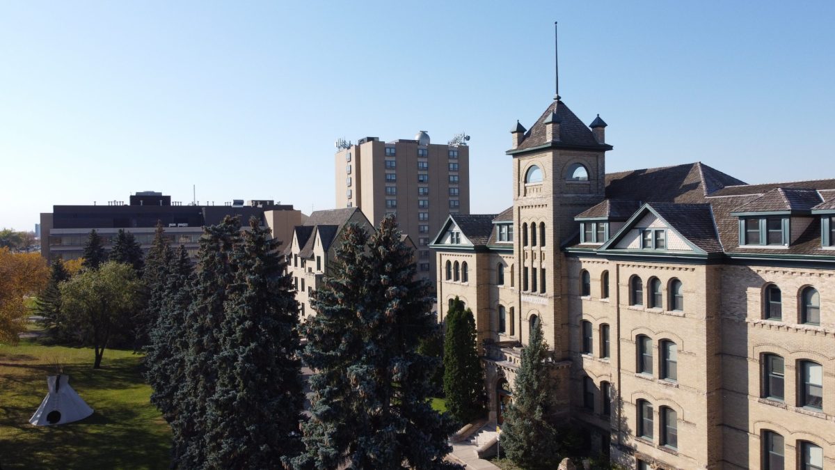 Several buildings are seen from the air