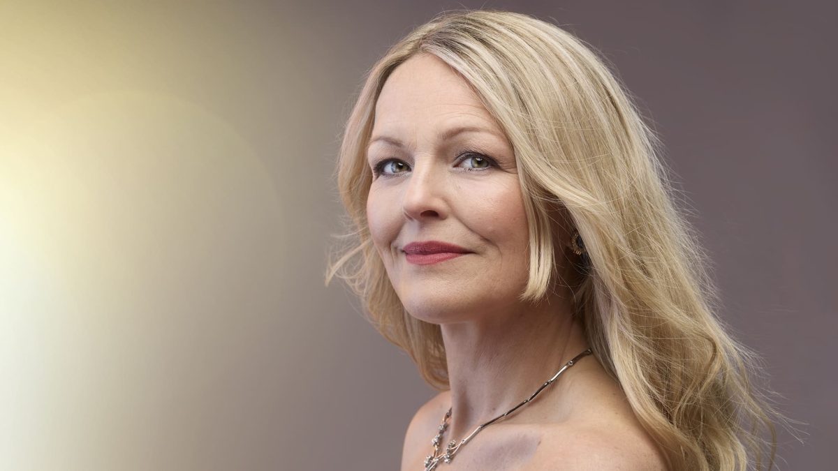 A woman looks up and to the side