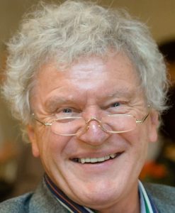 Headshot of a smiling man