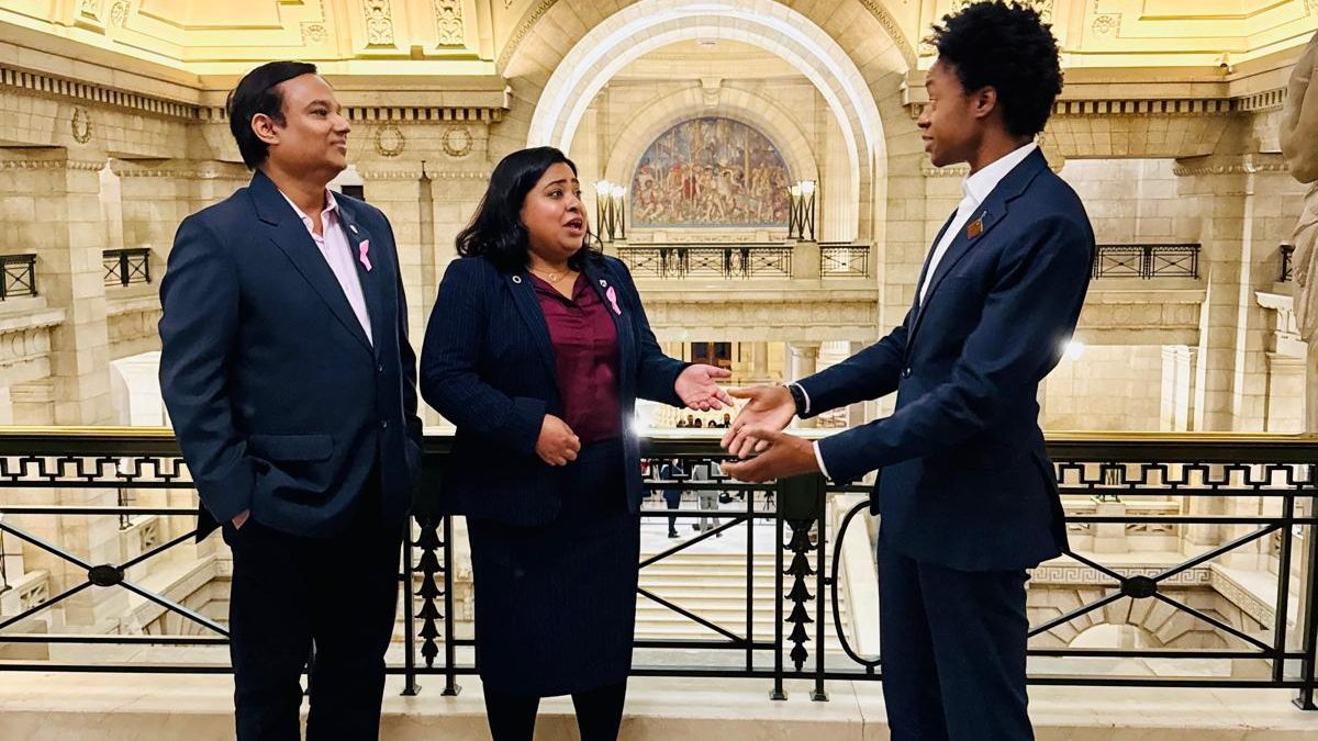 Three people speak in the Manitoba Legislature