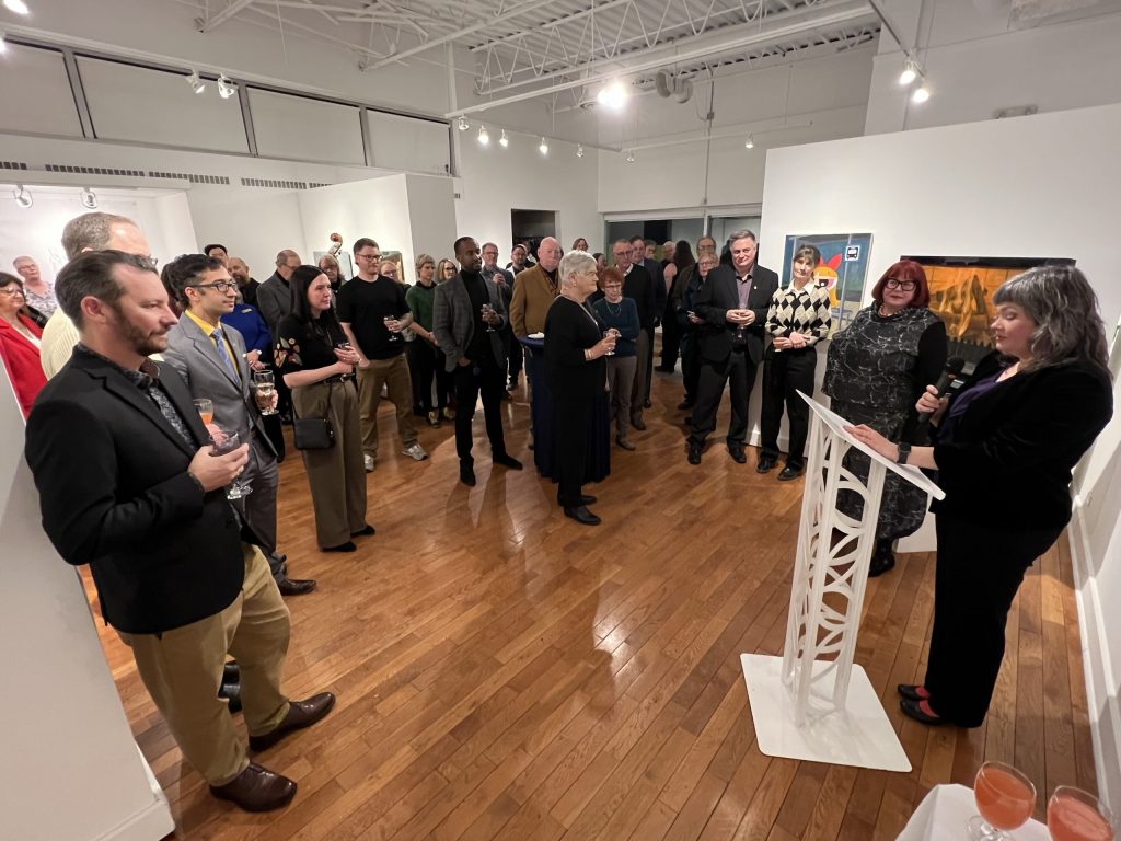 A group of people at an art gallery event