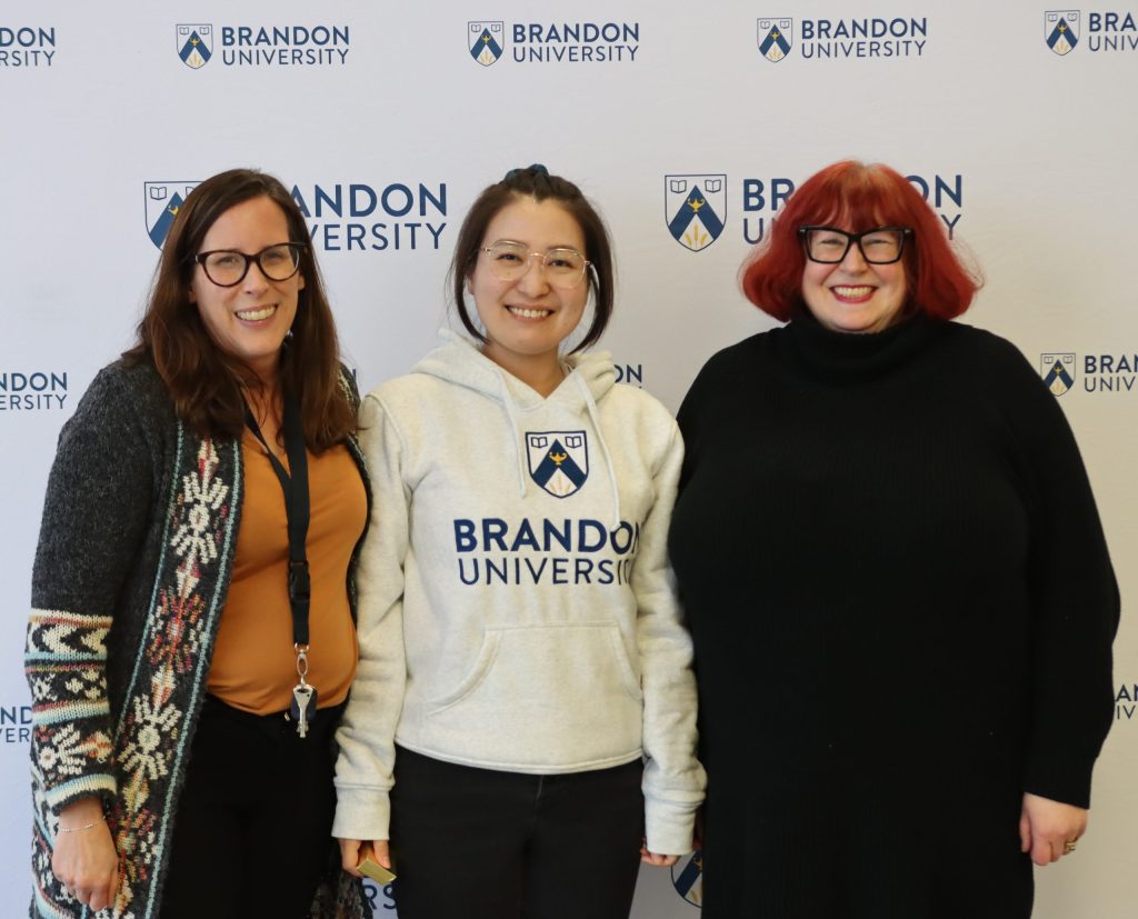 Three women pose