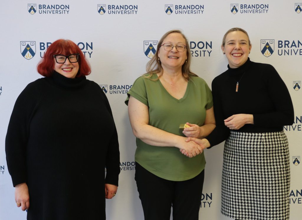 Three women pose