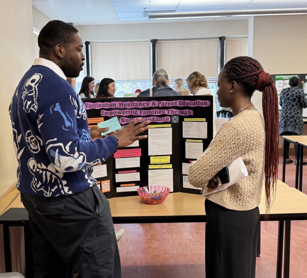 A man and a woman discuss a project.
