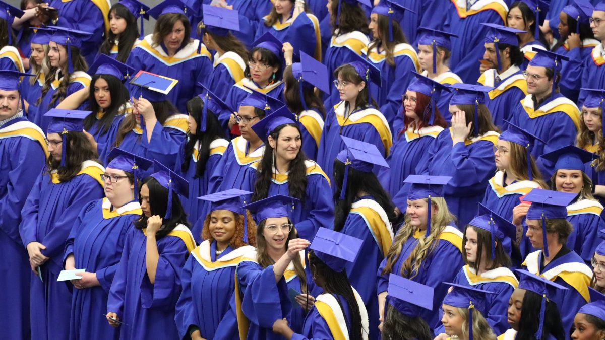 A sea of students in academic regalia