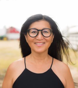 A woman smiles