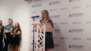 A young woman at a podium