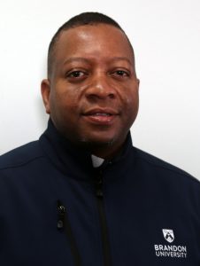 Head and shoulders photo of Davion Johnson, wearing a Brandon University jacket