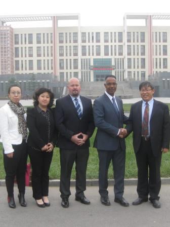 Dr. Fearon and Rowland with university officials in China, 2014 (web)