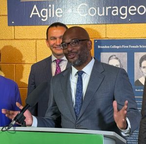 A man gestures while speaking