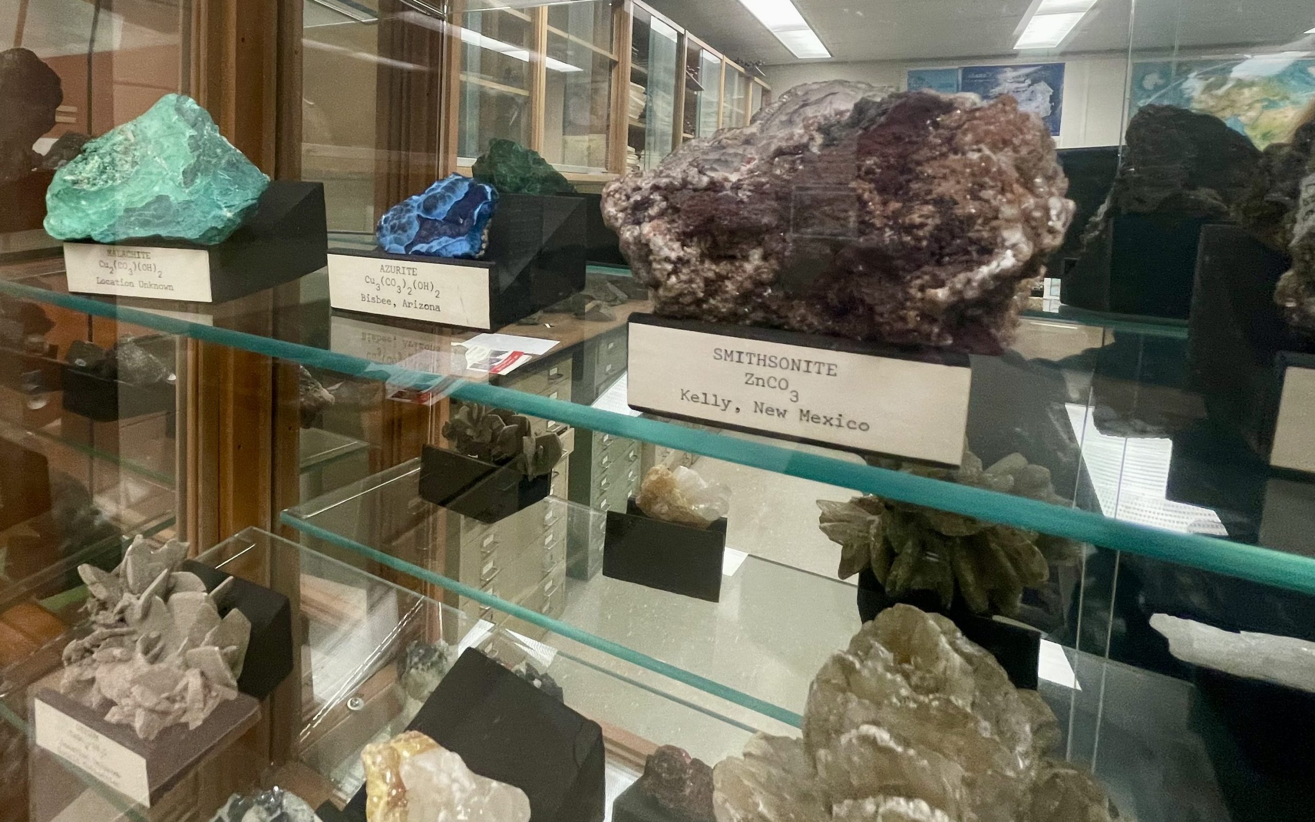A collection of colourful rocks in a display case