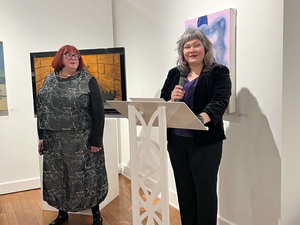 Two people at a podium