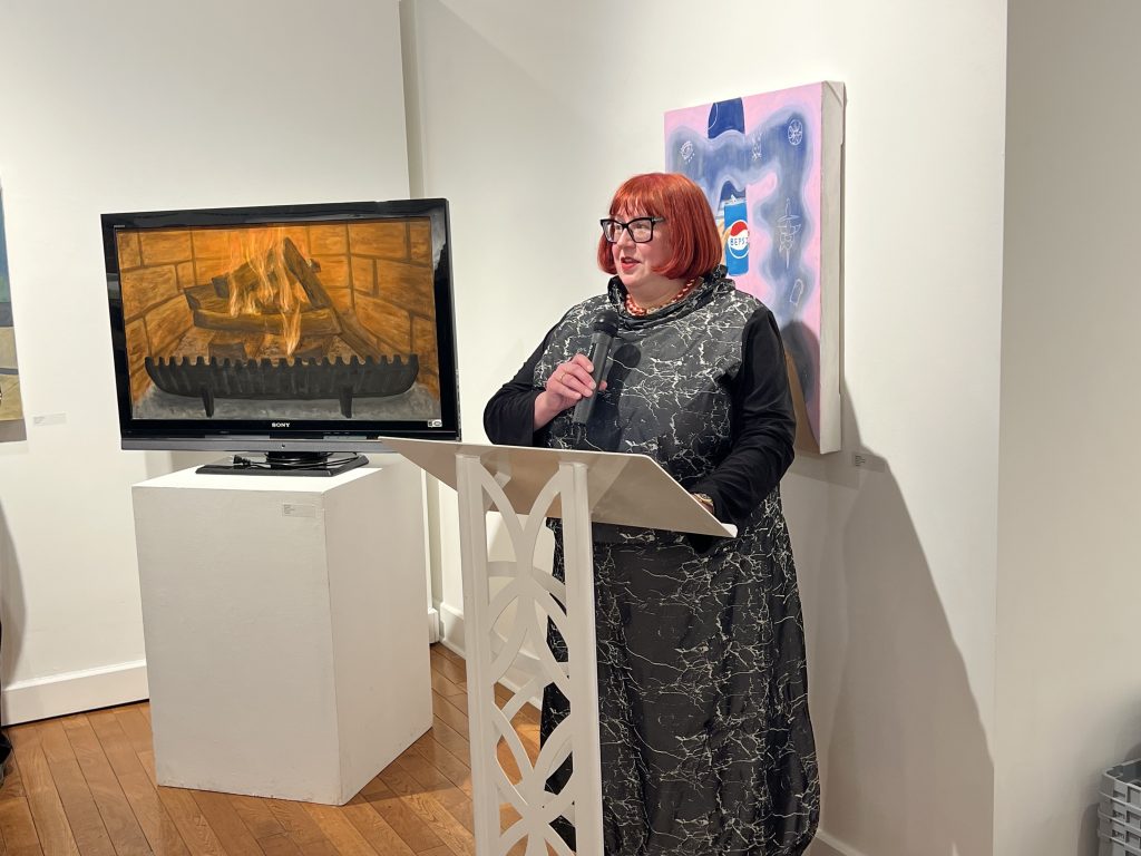 A person stands at a podium