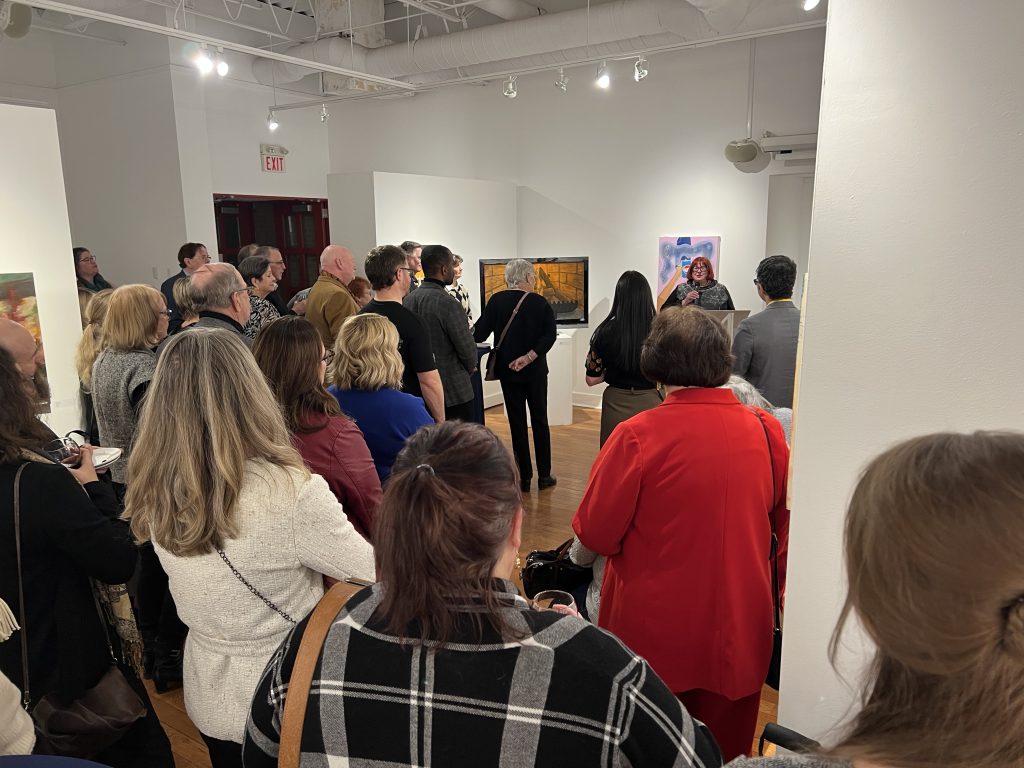 A group of people at an art gallery event