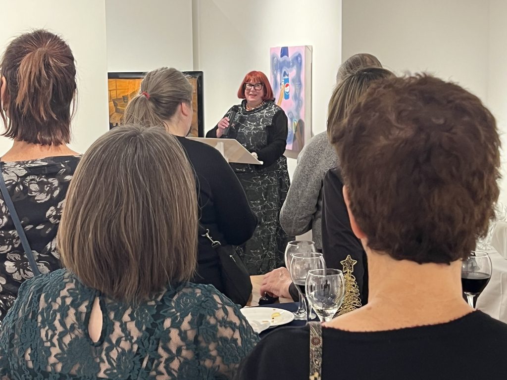 A group of people at an art gallery event