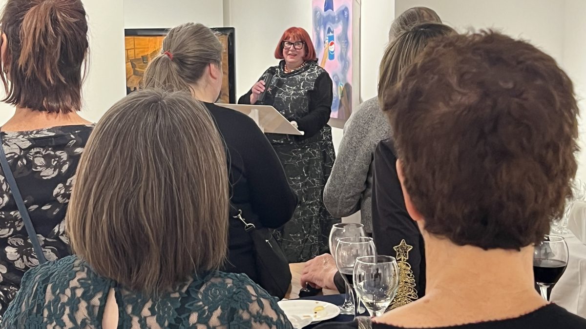 A group of people at an art gallery event