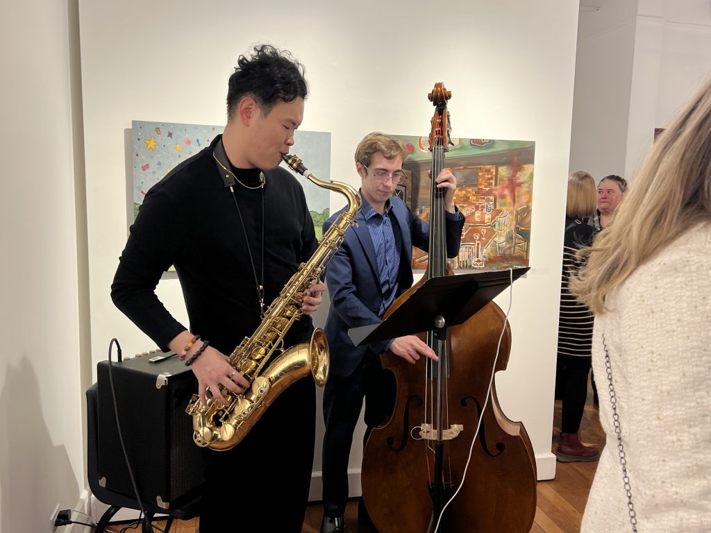 A group of people at an art gallery event