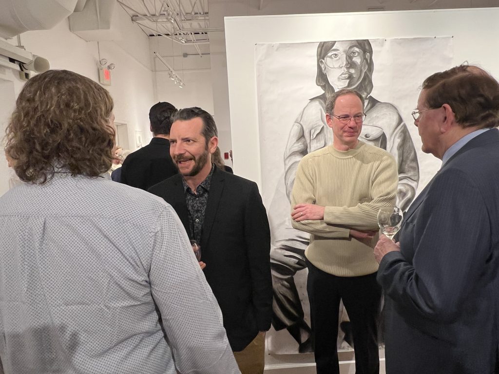 A group of people at an art gallery event