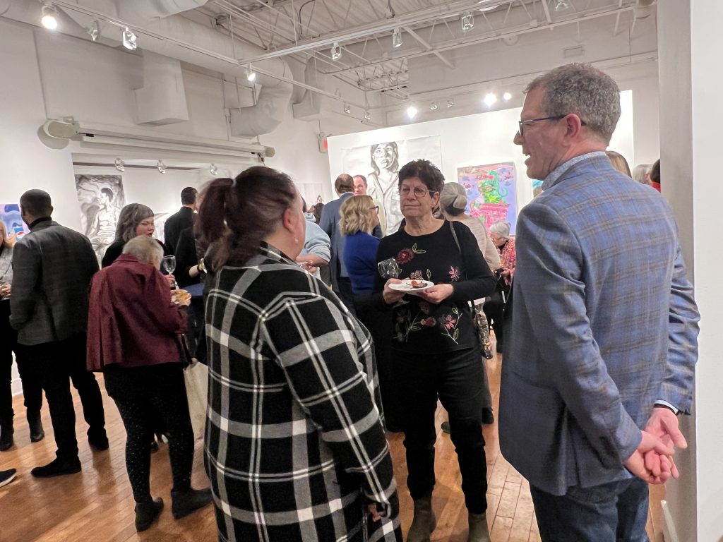 A group of people at an art gallery event