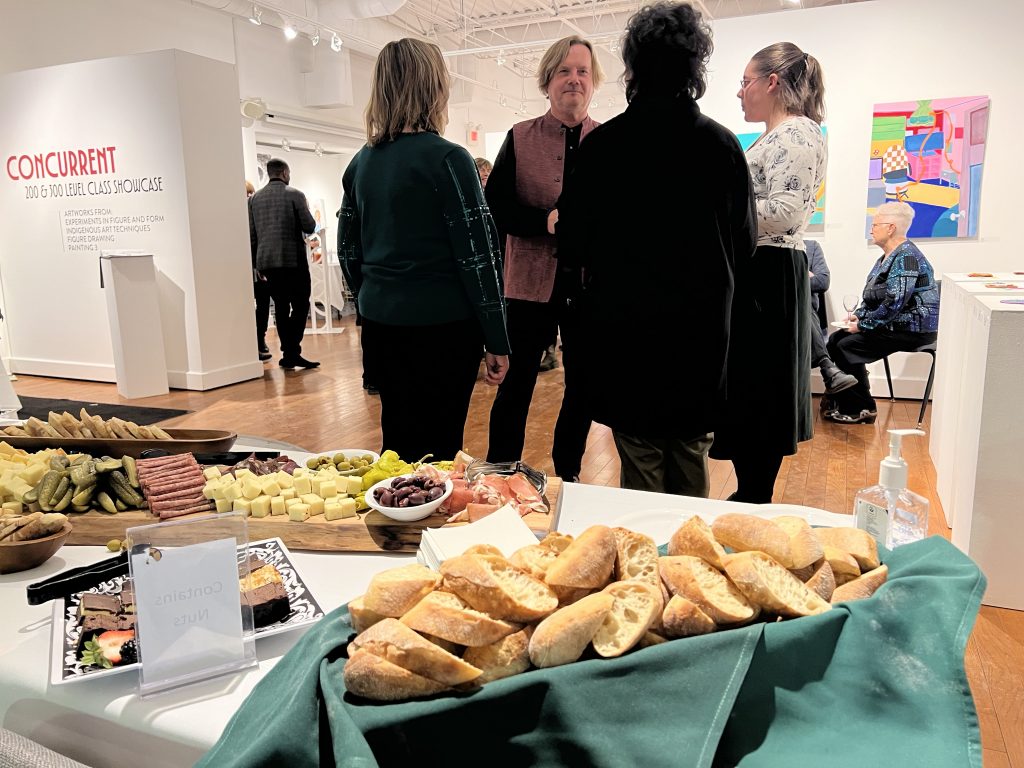 A group of people at an art gallery event