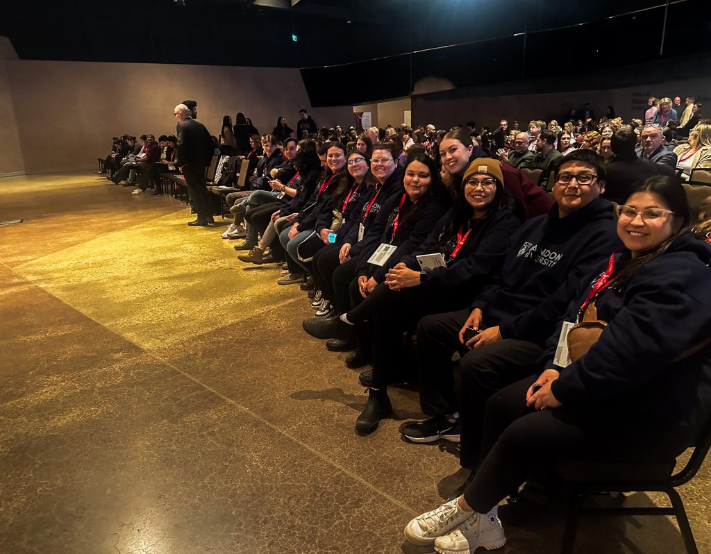 A large group of people in an auditorium