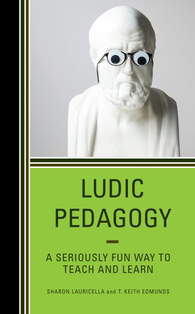 Book cover features a statue wearing glasses and the text "Ludic Pedagogy - a Seriously Fun Way to Teach and Learn"