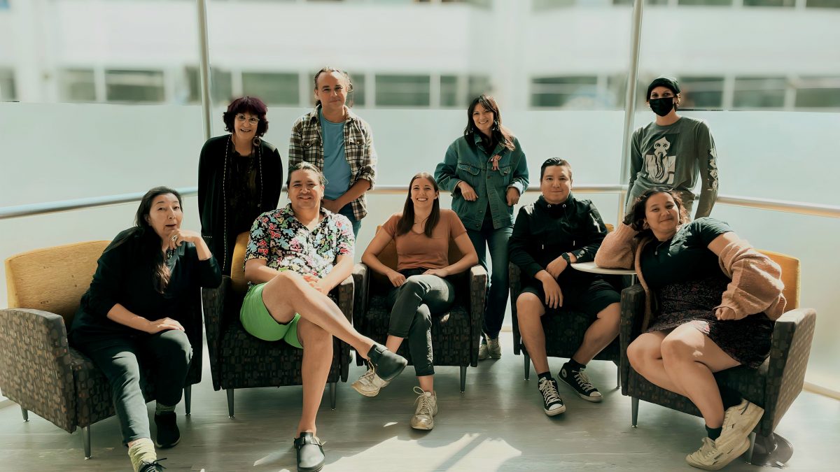 A group photo on couches.