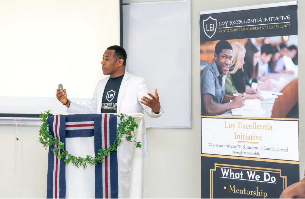 A man speaks at a lectern