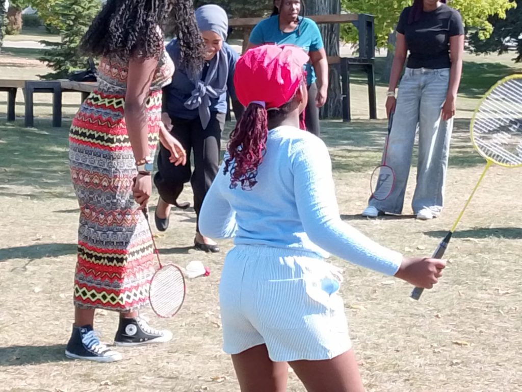 People play badminton